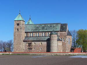 "Romanesque Collegiate Church in Tum" by Jan Mehlich, shared under Creative Commons - https://en.wikipedia.org/w/index.php?title=Collegiate_Church_of_St._Mary_and_St._Alexius,_Tum&previous=yes#/media/File:Tum_-_Kolegiata_01.jpg